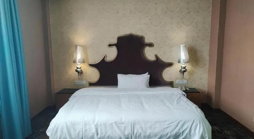 Bed in Foshan Nanhai Huifeng Holiday Hotel