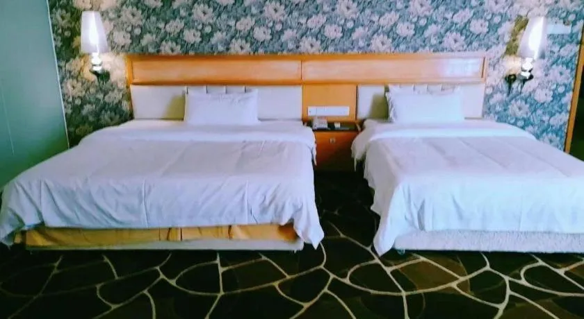 Bed in Foshan Nanhai Huifeng Holiday Hotel