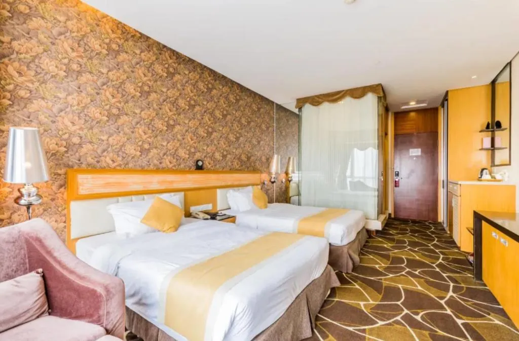 Bed in Foshan Nanhai Huifeng Holiday Hotel