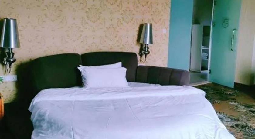 Bed in Foshan Nanhai Huifeng Holiday Hotel