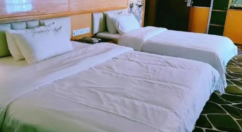 Bed in Foshan Nanhai Huifeng Holiday Hotel