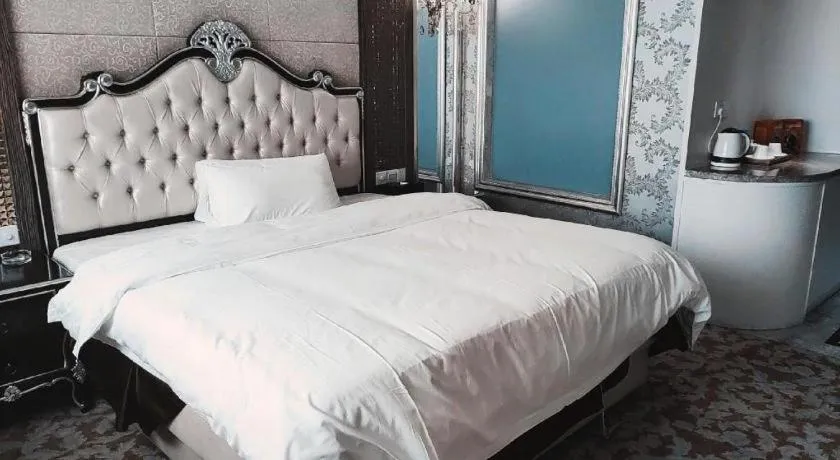 Bed in Foshan Nanhai Huifeng Holiday Hotel