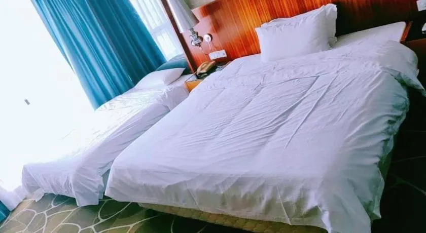 Bed in Foshan Nanhai Huifeng Holiday Hotel