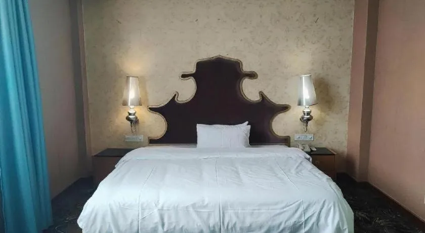 Bed in Foshan Nanhai Huifeng Holiday Hotel