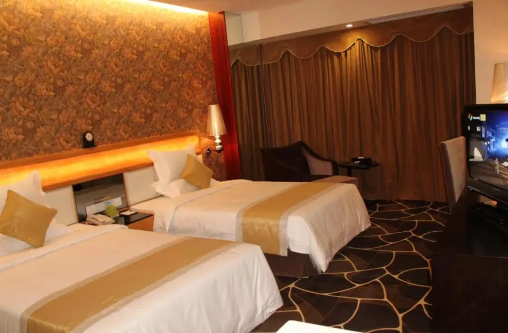 Bed in Foshan Nanhai Huifeng Holiday Hotel