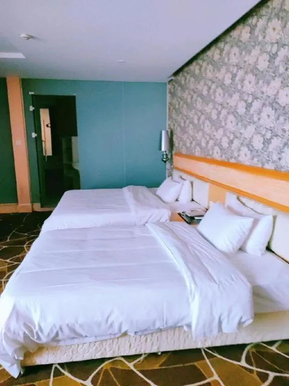 Bed in Foshan Nanhai Huifeng Holiday Hotel
