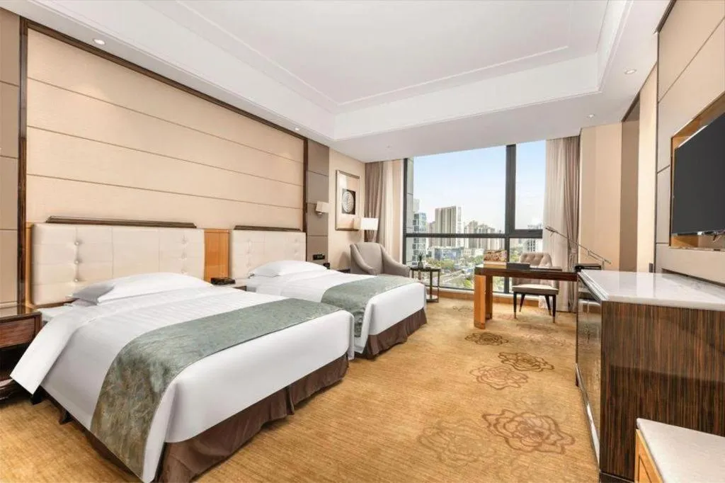 Bed in Jin Jiang Mingcheng Hotel