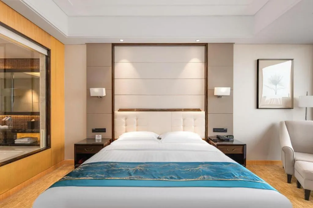Bed in Jin Jiang Mingcheng Hotel
