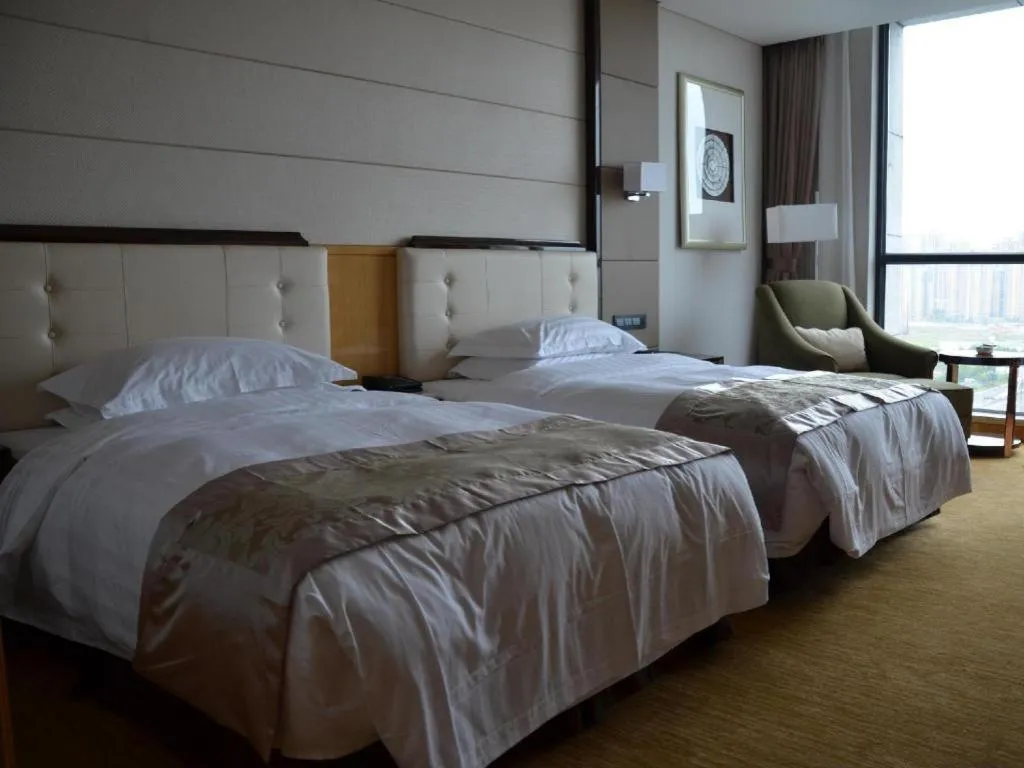 Bed in Jin Jiang Mingcheng Hotel