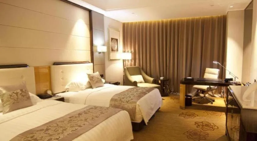 Bed in Jin Jiang Mingcheng Hotel