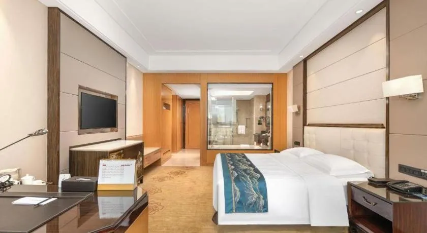 Bed in Jin Jiang Mingcheng Hotel