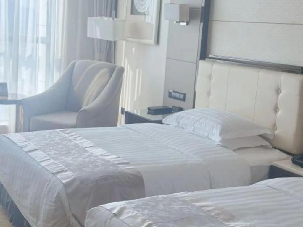 Bed in Jin Jiang Mingcheng Hotel