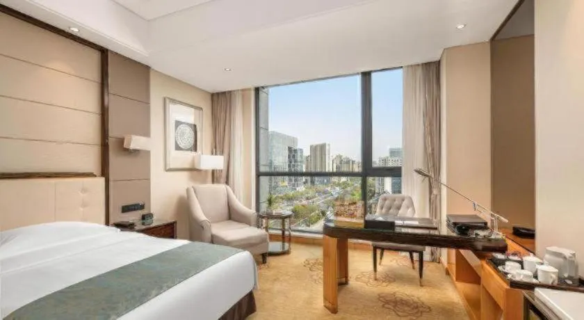 Bed in Jin Jiang Mingcheng Hotel