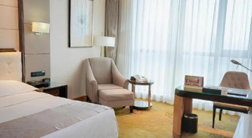 Bed in Jin Jiang Mingcheng Hotel