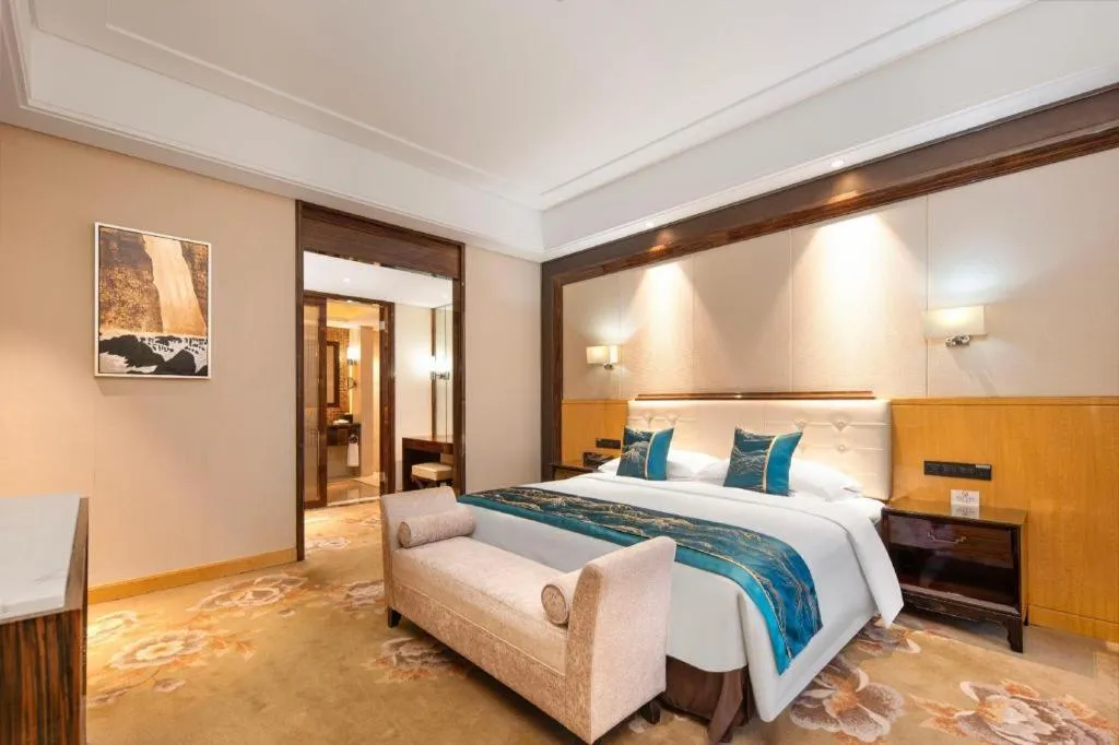 Bed in Jin Jiang Mingcheng Hotel