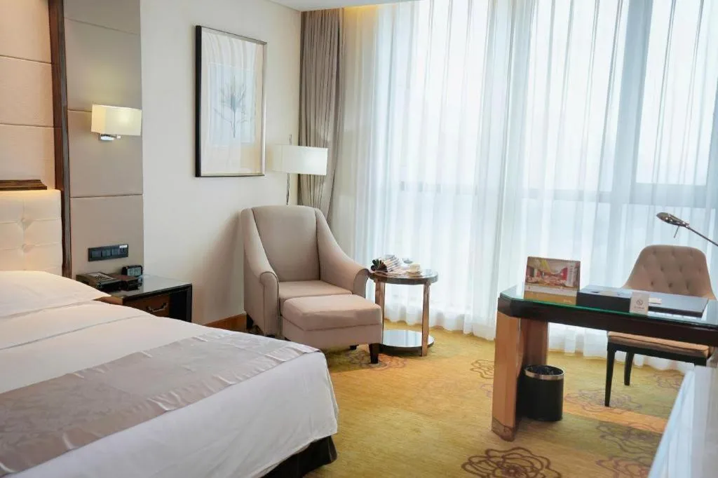 Bed in Jin Jiang Mingcheng Hotel