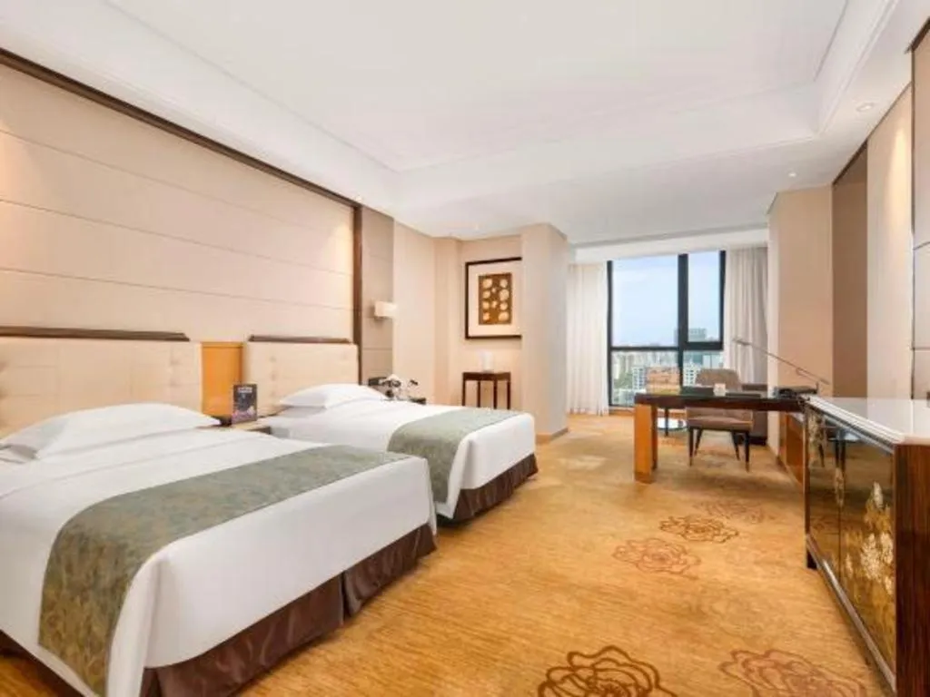 Bed in Jin Jiang Mingcheng Hotel