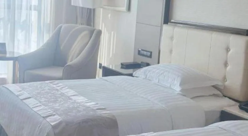 Bed in Jin Jiang Mingcheng Hotel