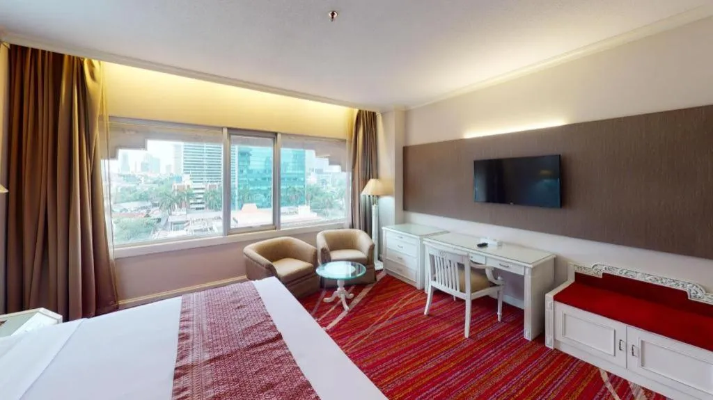 Bed in Kartika Chandra Hotel