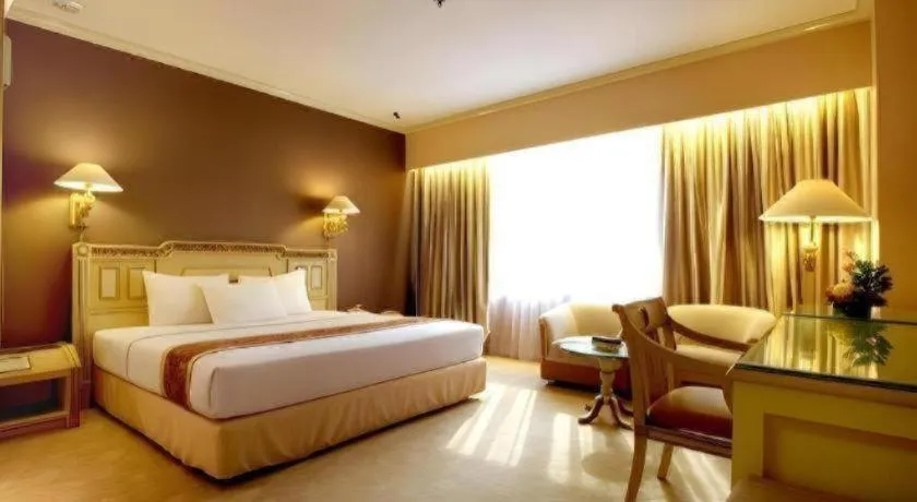 Bed in Kartika Chandra Hotel