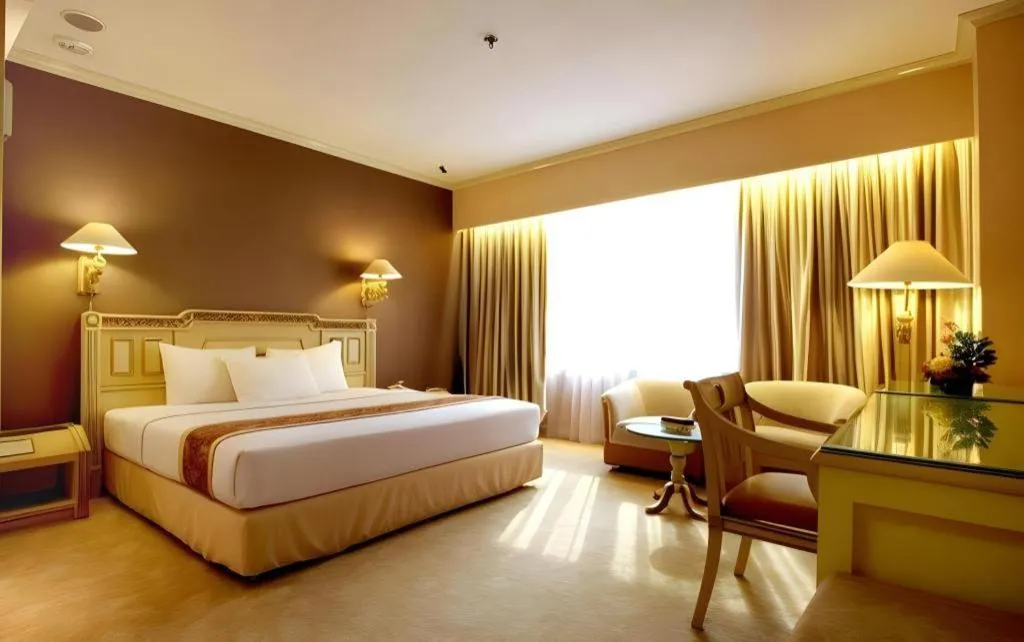 Bed in Kartika Chandra Hotel