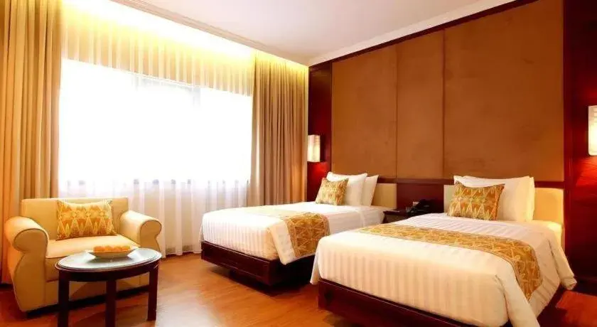 Bed in Kartika Chandra Hotel Bed in Kartika Chandra Hotel