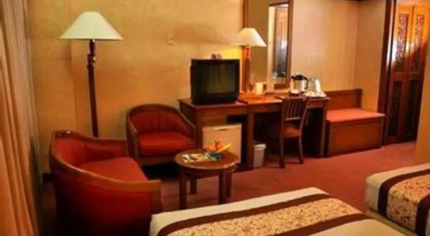 Bed in Kartika Chandra Hotel