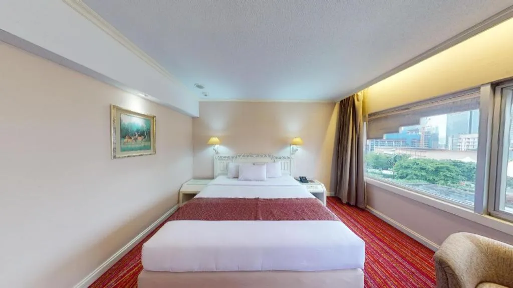 Bed in Kartika Chandra Hotel