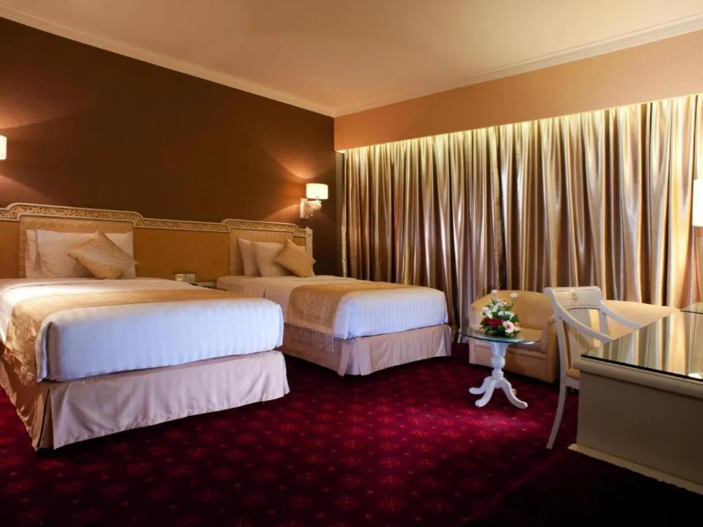 Bed in Kartika Chandra Hotel