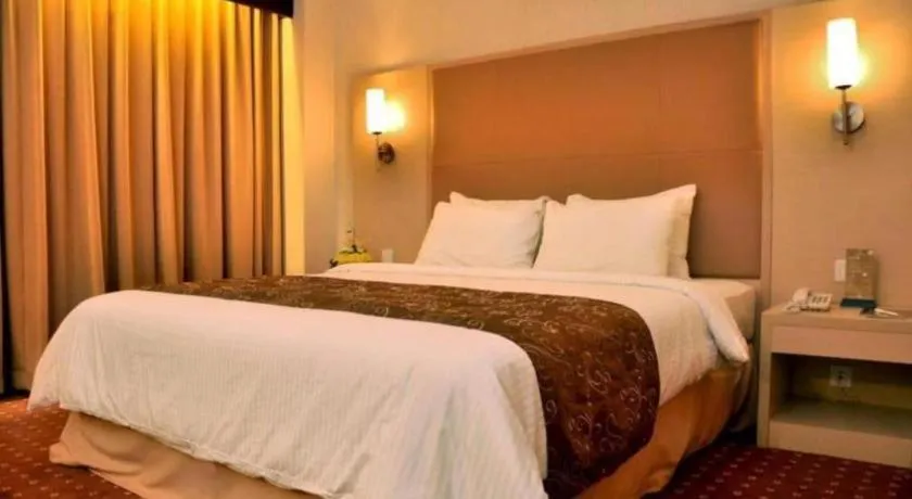 Bed in Kartika Chandra Hotel