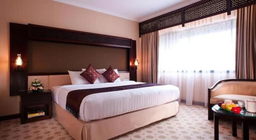 Bed in Kartika Chandra Hotel