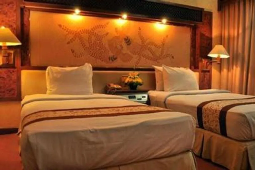 Bed in Kartika Chandra Hotel
