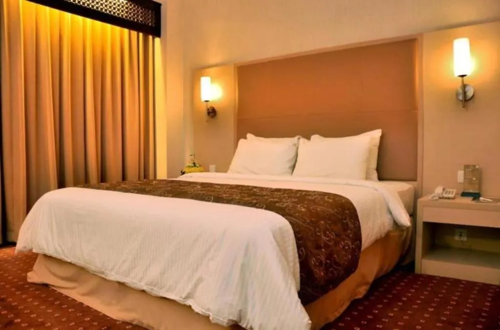 Bed in Kartika Chandra Hotel