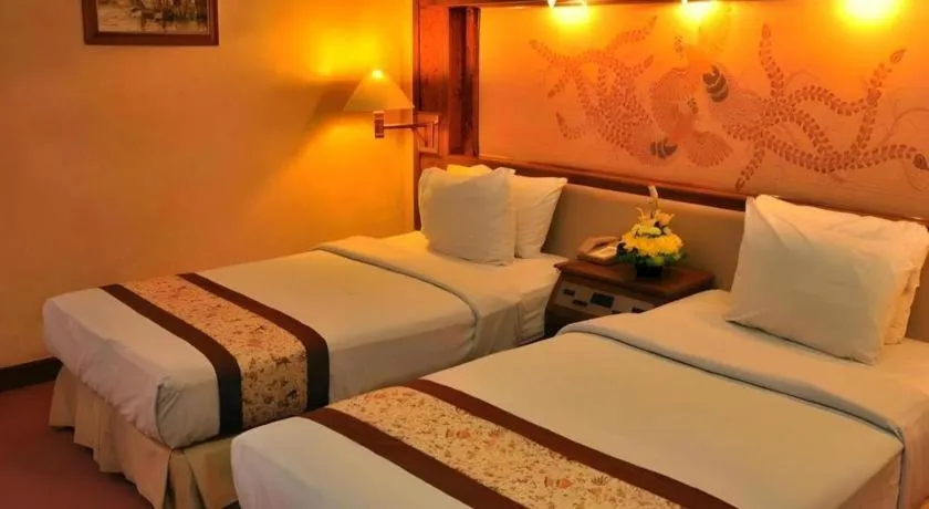 Bed in Kartika Chandra Hotel