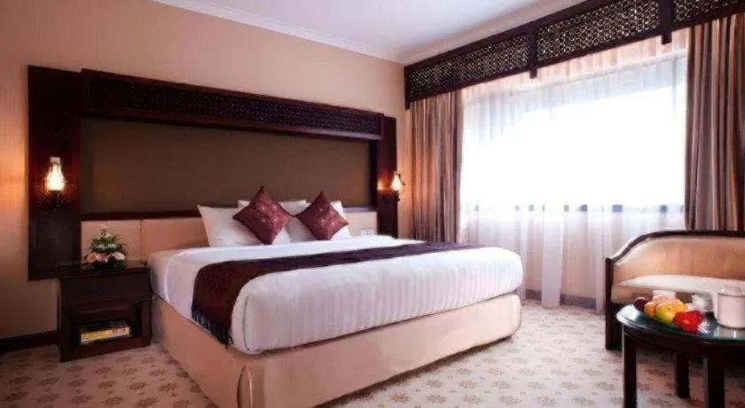 Bed in Kartika Chandra Hotel