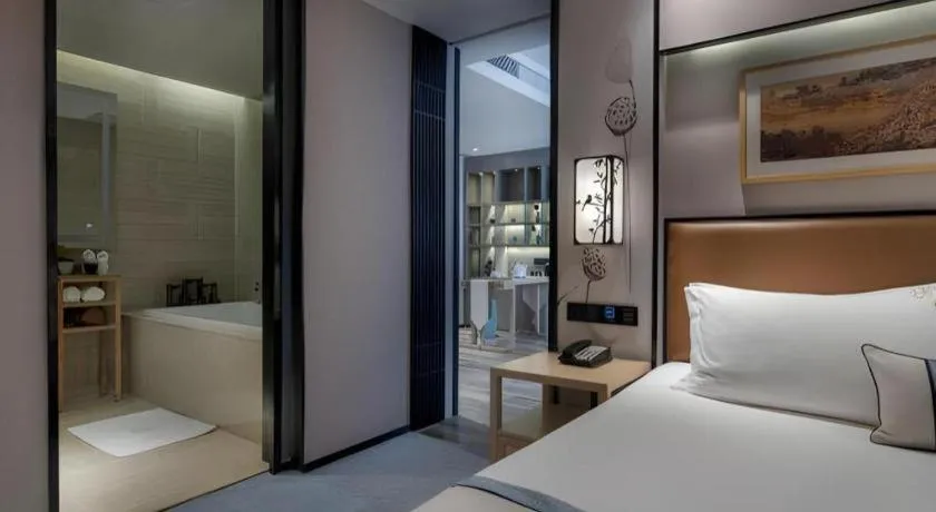 Bed in Yuan Culture Hotel Shenzhen World Shajing