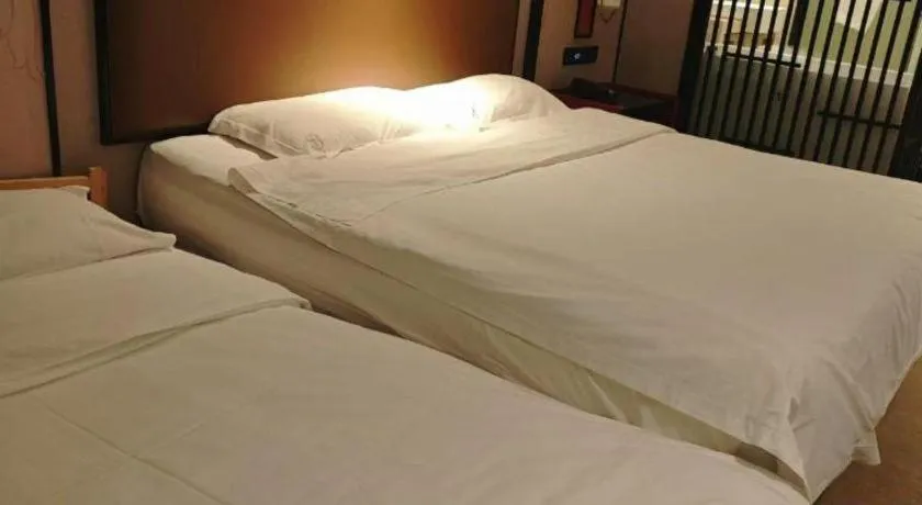 Bed in Yuan Culture Hotel Shenzhen World Shajing