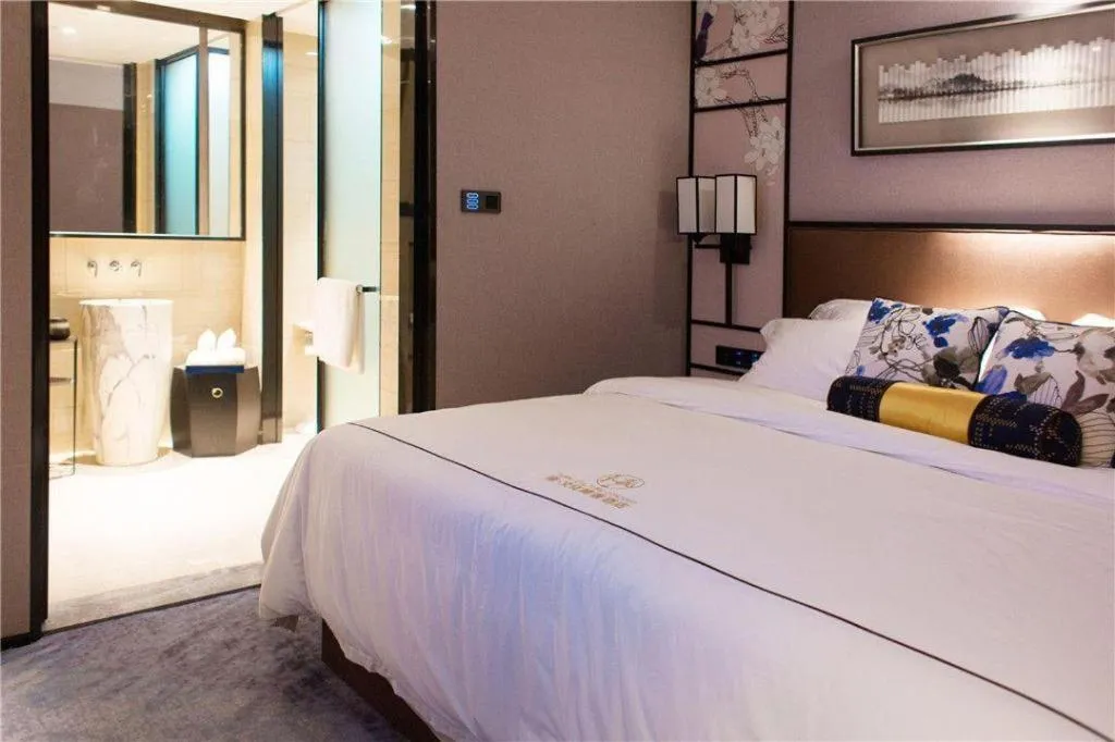 Bed in Yuan Culture Hotel Shenzhen World Shajing
