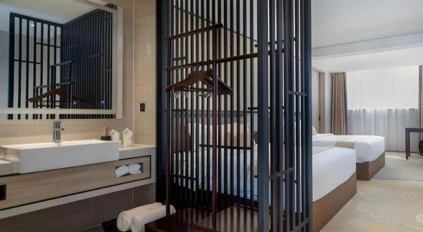 Bed in Yuan Culture Hotel Shenzhen World Shajing