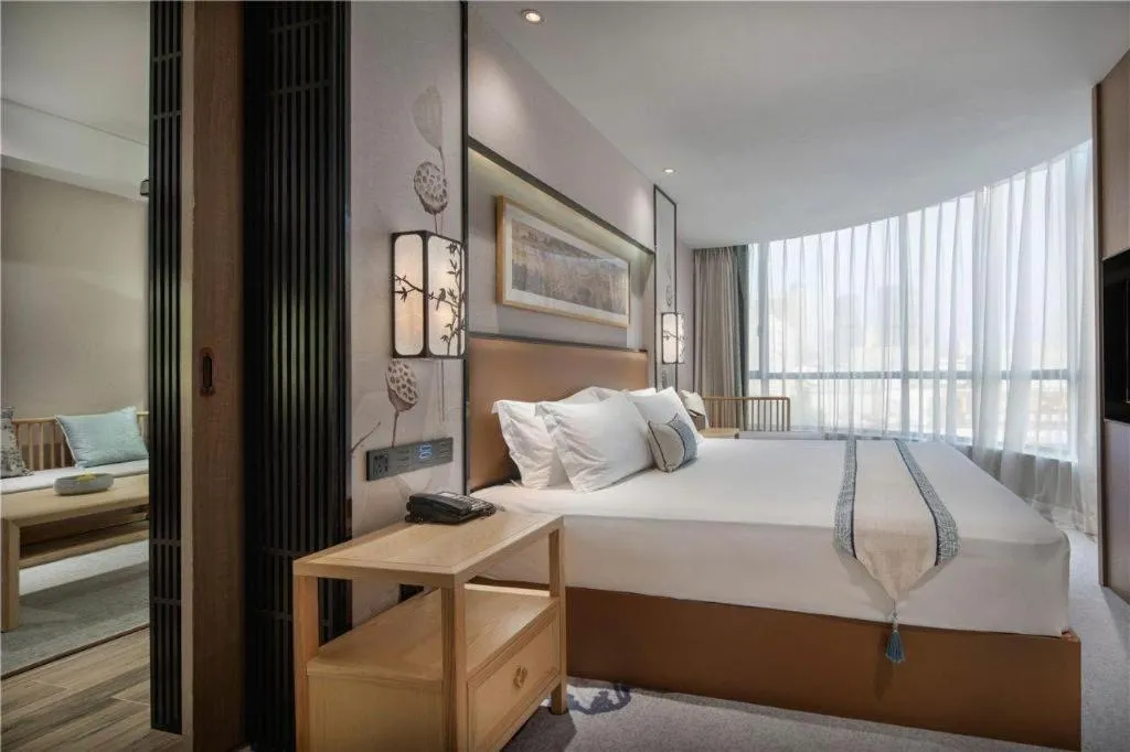 Bed in Yuan Culture Hotel Shenzhen World Shajing