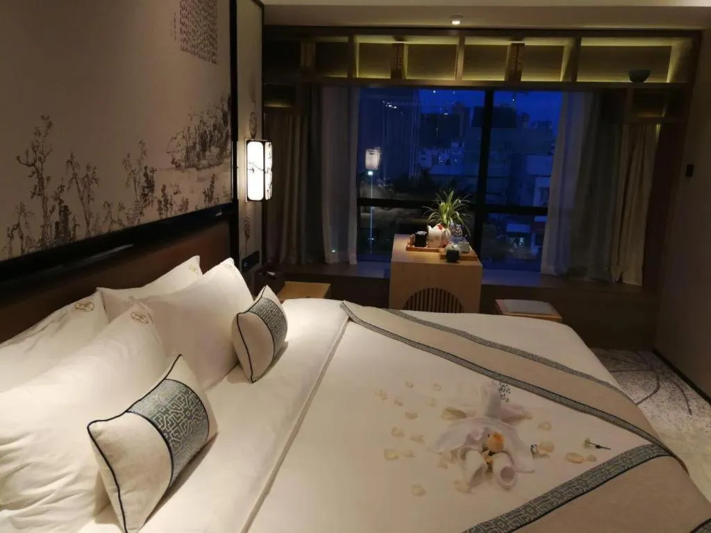 Bed in Yuan Culture Hotel Shenzhen World Shajing