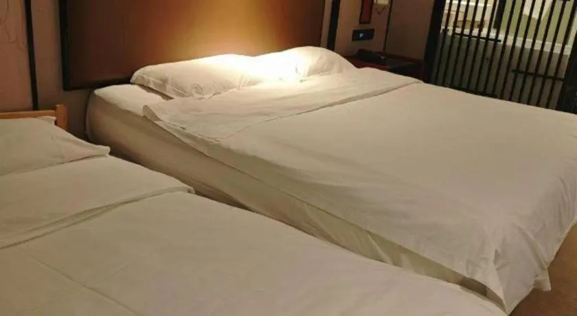 Bed in Yuan Culture Hotel Shenzhen World Shajing