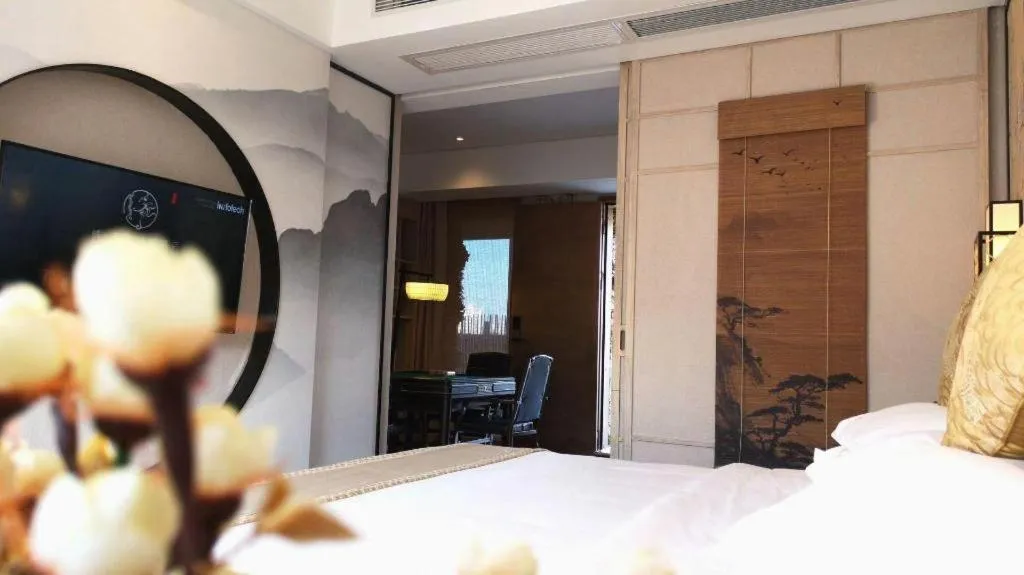 Bed in Yuan Culture Hotel Shenzhen World Shajing