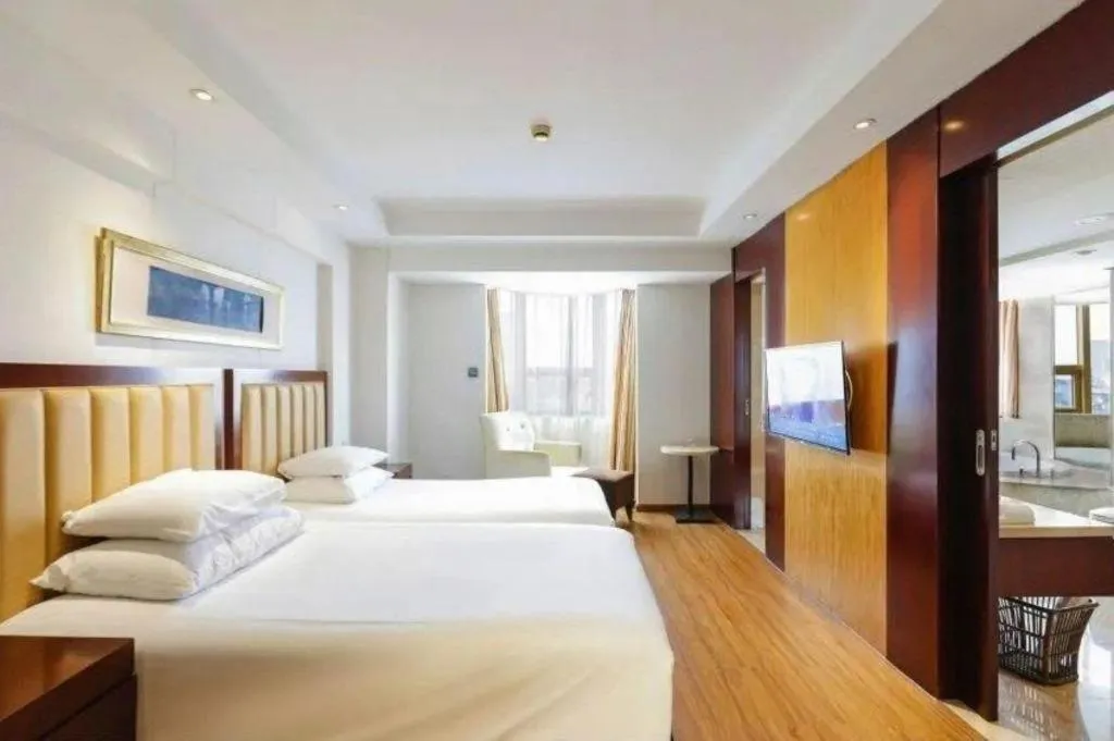 Bed in New Century Shaoxing Grand Hotel