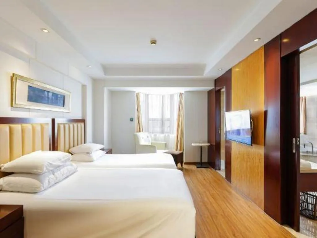 Bed in New Century Shaoxing Grand Hotel