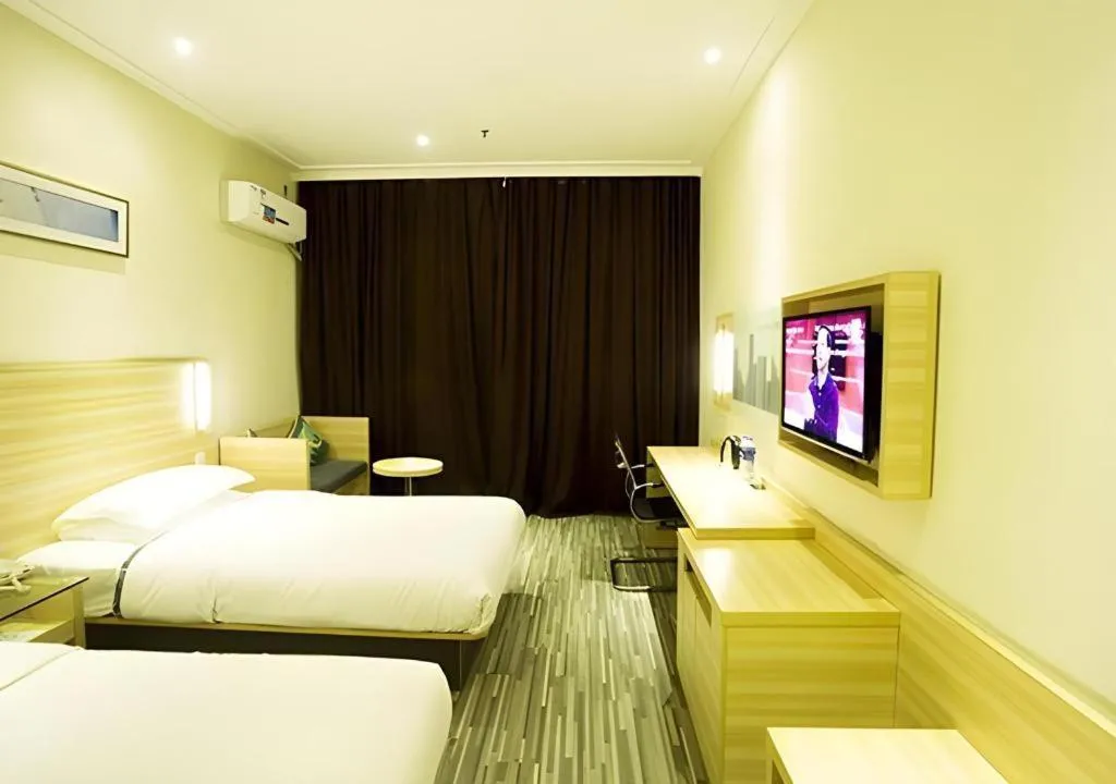 Bed in City Comfort Inn Ezhou Wenxing Avenue Central Hospital