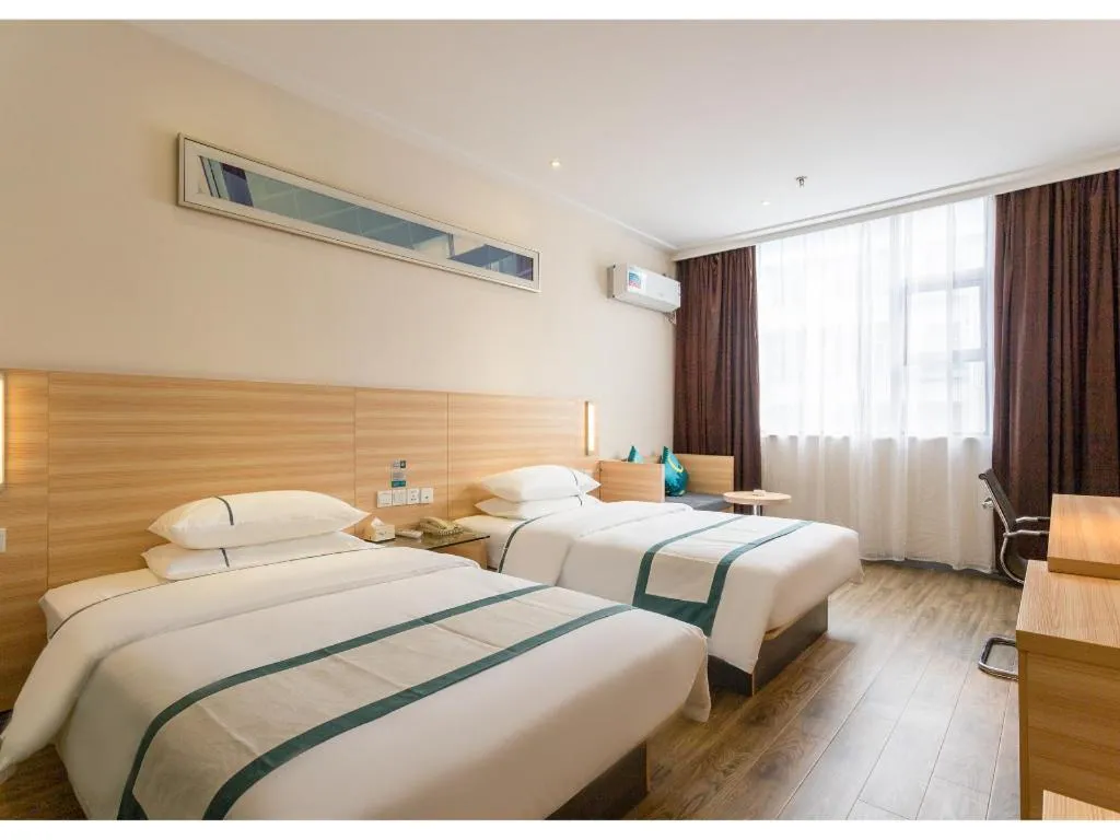 Bed in City Comfort Inn Ezhou Wenxing Avenue Central Hospital