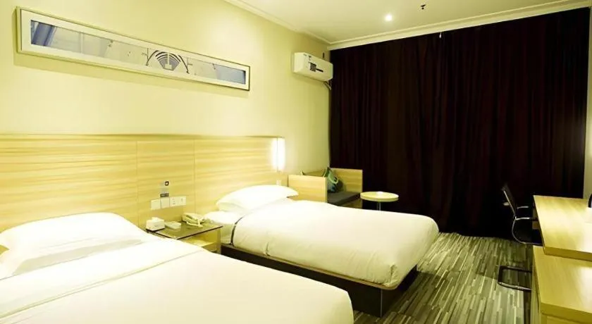 Bed in City Comfort Inn Ezhou Wenxing Avenue Central Hospital