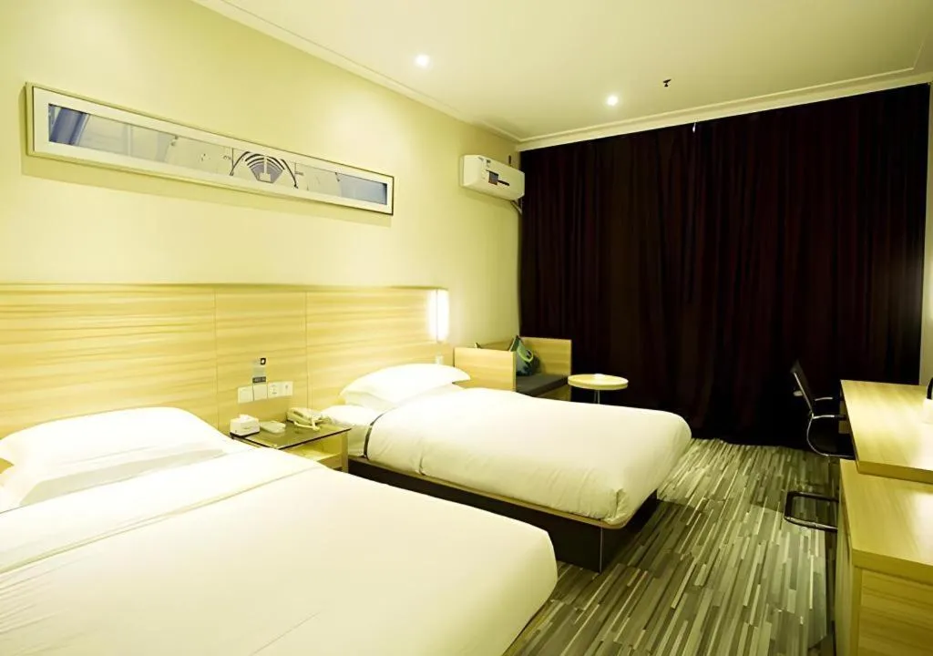 Bed in City Comfort Inn Ezhou Wenxing Avenue Central Hospital