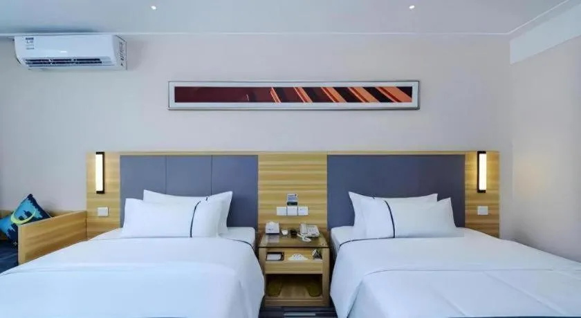Bed in City Comfort Inn Meishan Sansu Temple